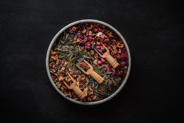 A bowl filled with various types of herbs